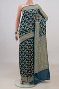 Blue Georgette Saree with Fancy on the body and Fancy Border.  displayed on a mannequin