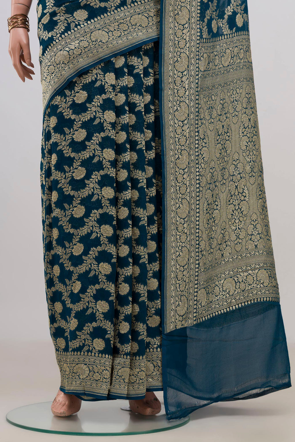 Pleats and pallu of Blue Georgette Saree with Fancy on the body and Fancy Border. 