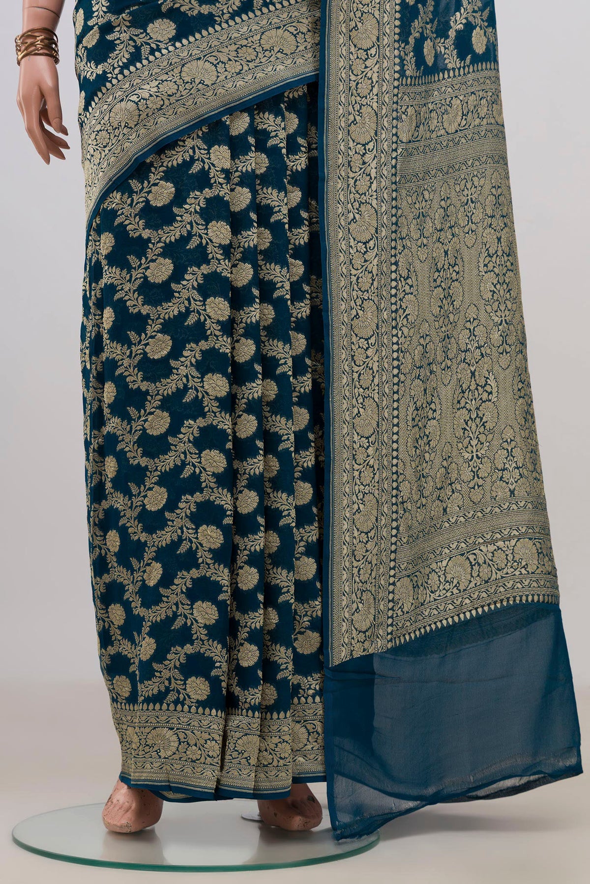 Pleats and pallu of Blue Georgette Saree with Fancy on the body and Fancy Border. 