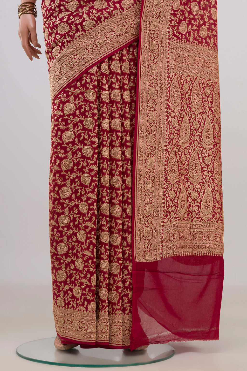 Pleats and pallu of Red Georgette Saree with Fancy on the body and Fancy Border. 
