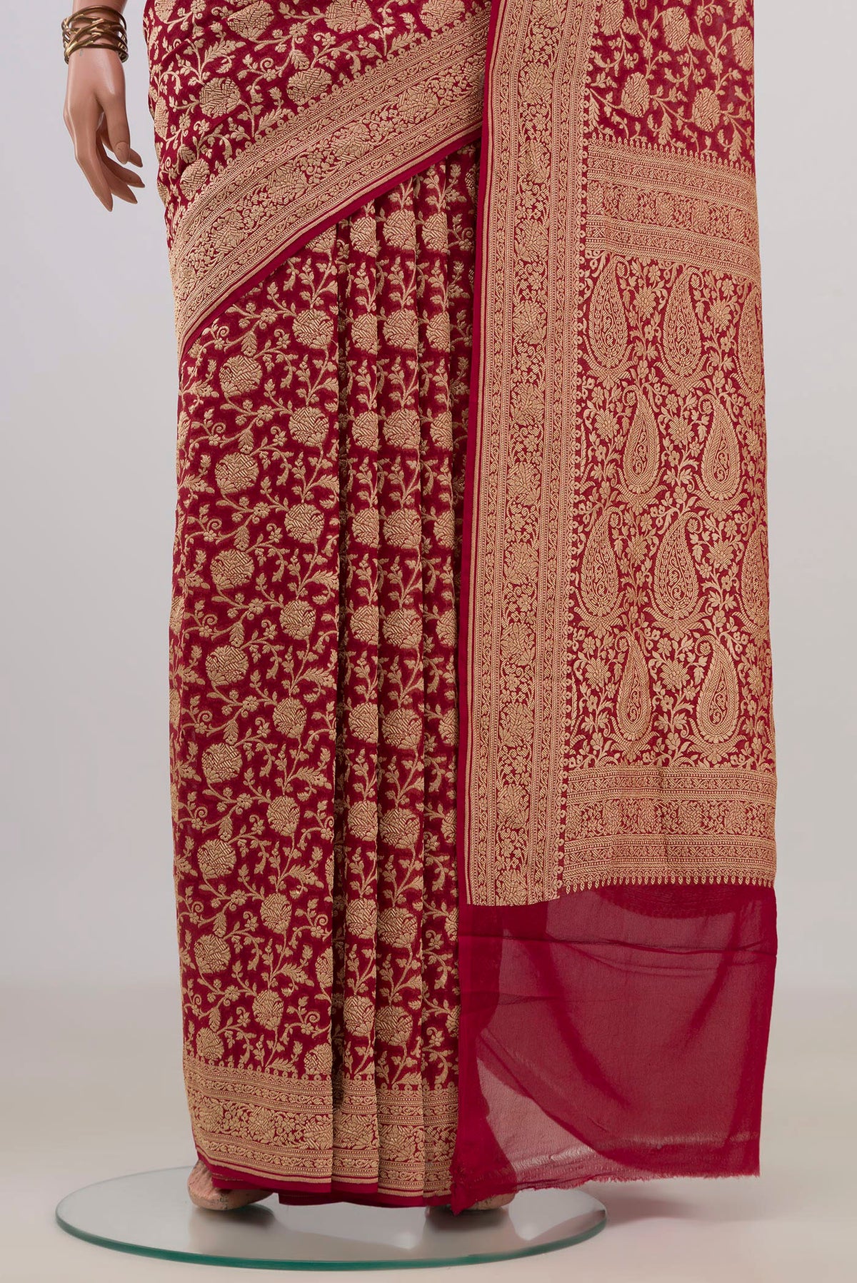 Pleats and pallu of Red Georgette Saree with Fancy on the body and Fancy Border. 