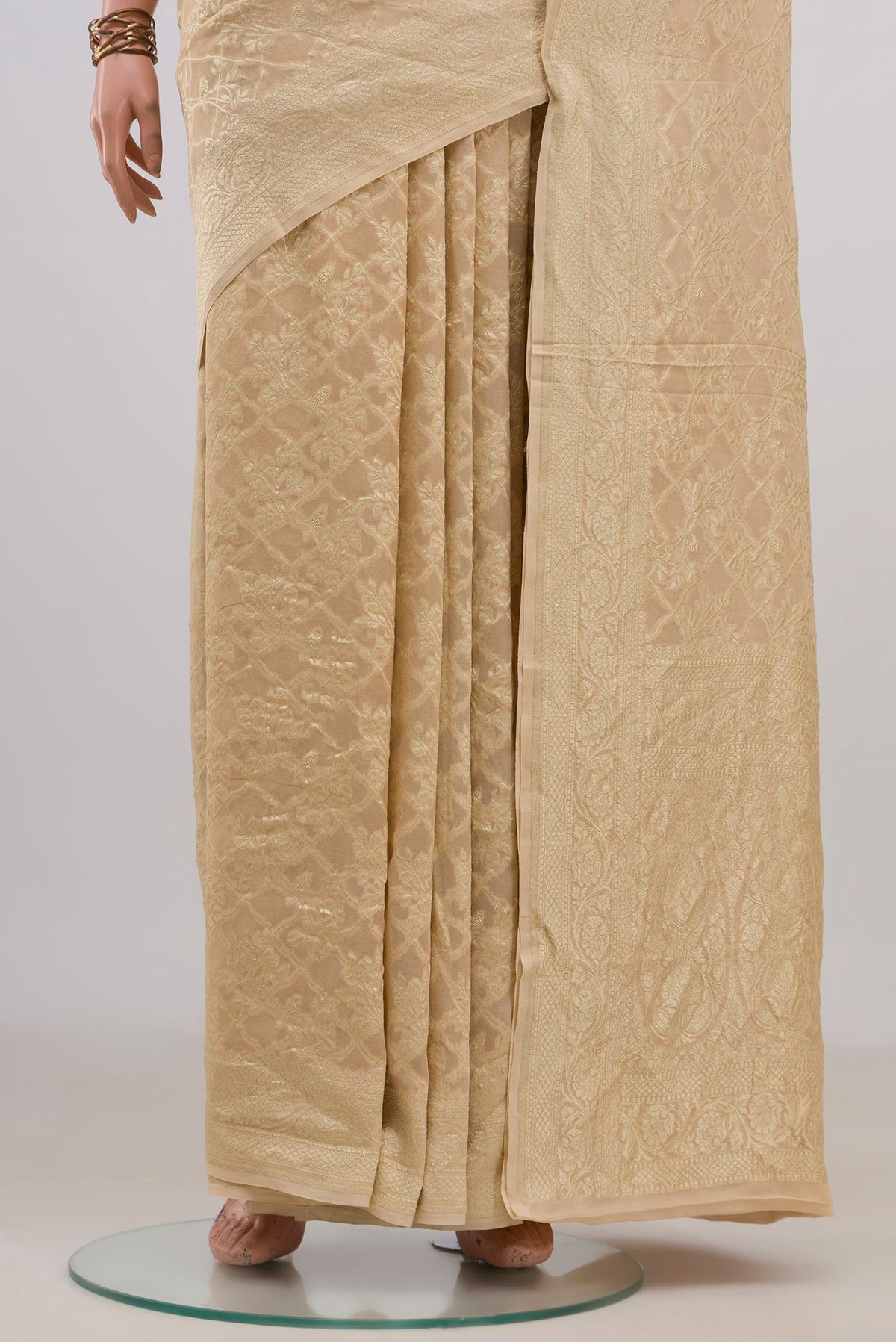 Pleats and pallu of Sandal Banarasi Georgette Saree with Zari Brocade on the body and Fancy Border. 