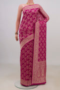 Pink Georgette Saree with Fancy on the body and Fancy Border.  displayed on a mannequin