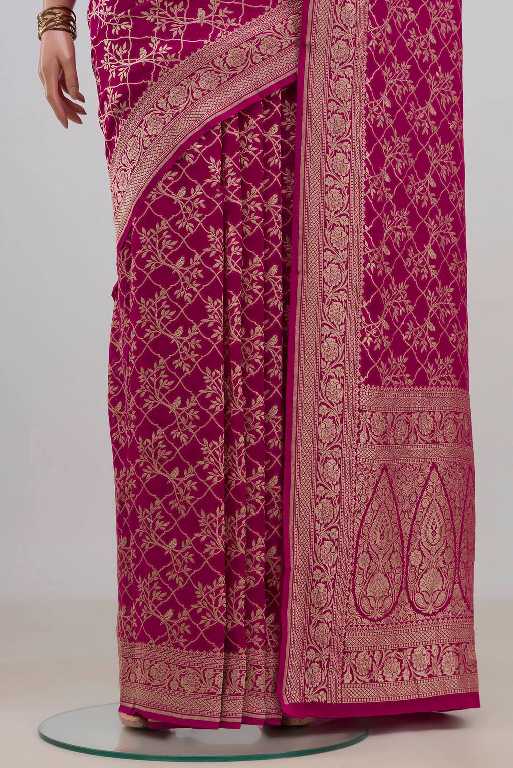Pleats and pallu of Pink Georgette Saree with Fancy on the body and Fancy Border. 