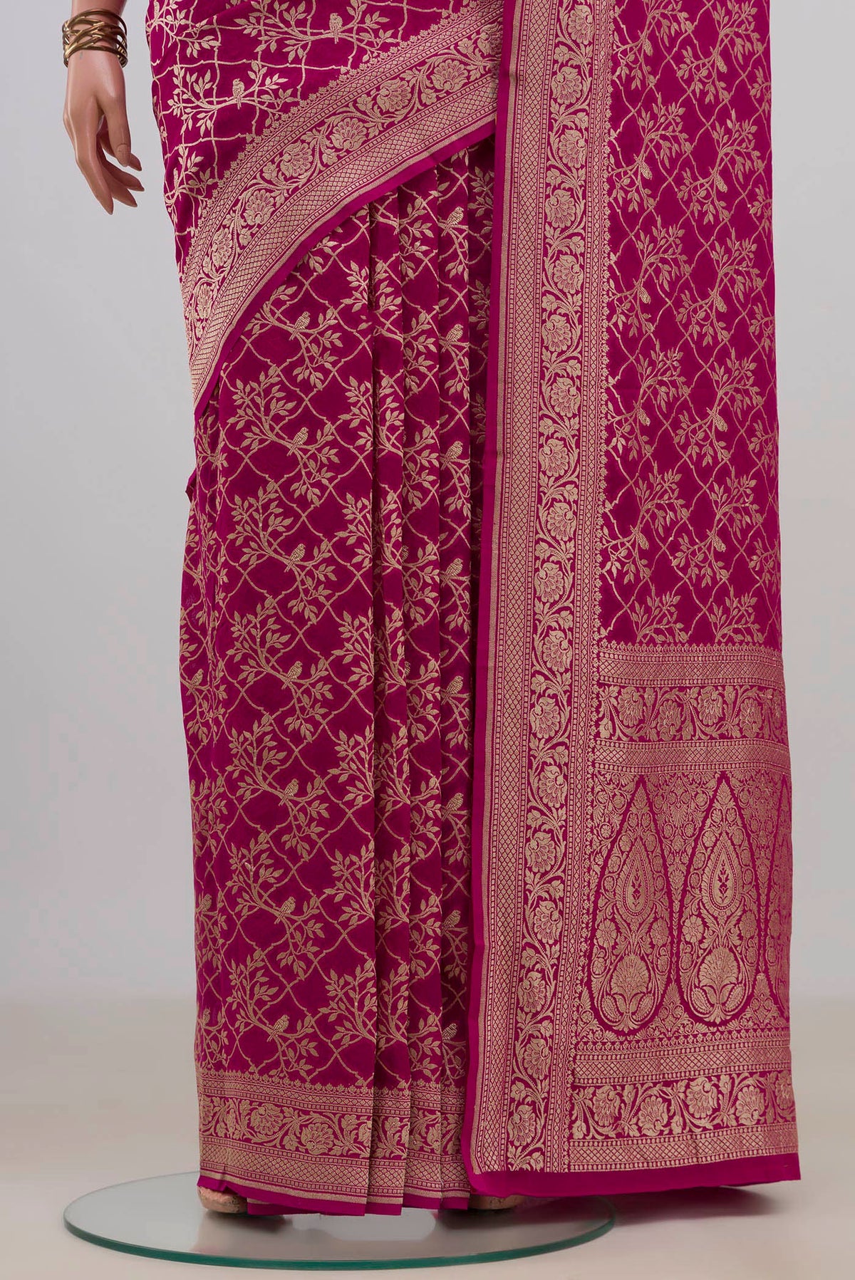 Pleats and pallu of Pink Georgette Saree with Fancy on the body and Fancy Border. 