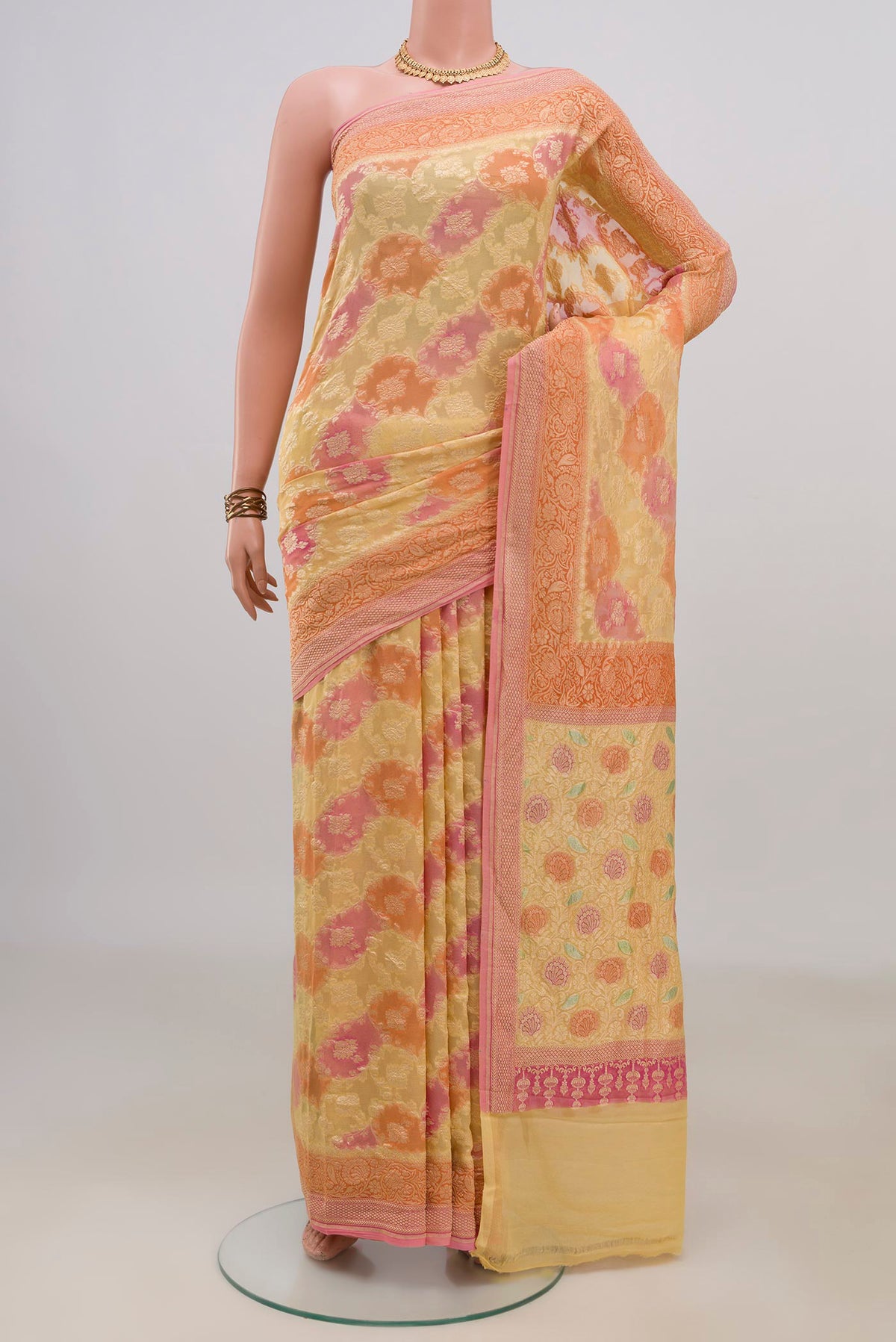 Multi Color Georgette Saree with Fancy on the body and Fancy Border.  displayed on a mannequin