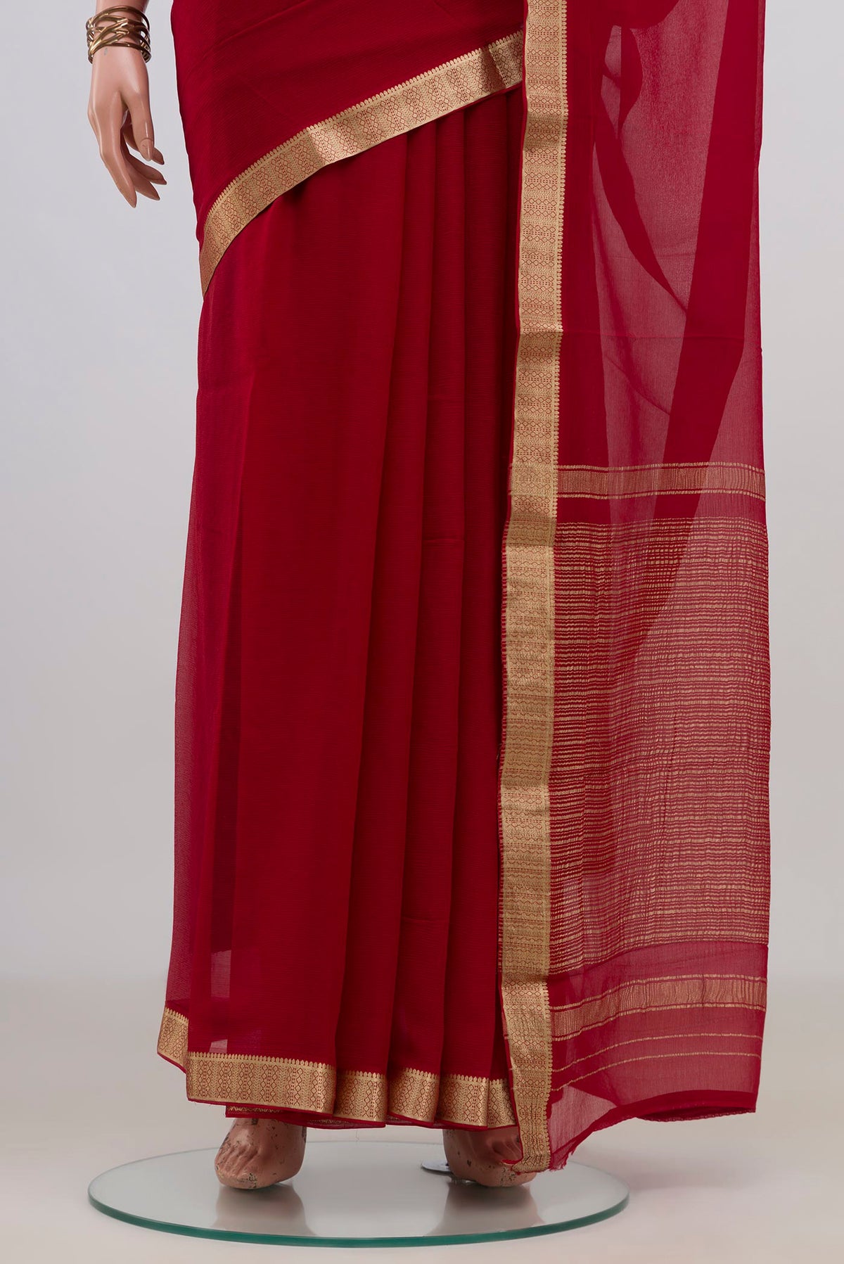 Pleats and pallu of Red Mysore Chiffon Saree with Plain Body and Zari Border. 