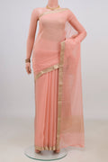 Peach Mysore Chiffon Saree with Plain Body and Zari Border.  displayed on a mannequin