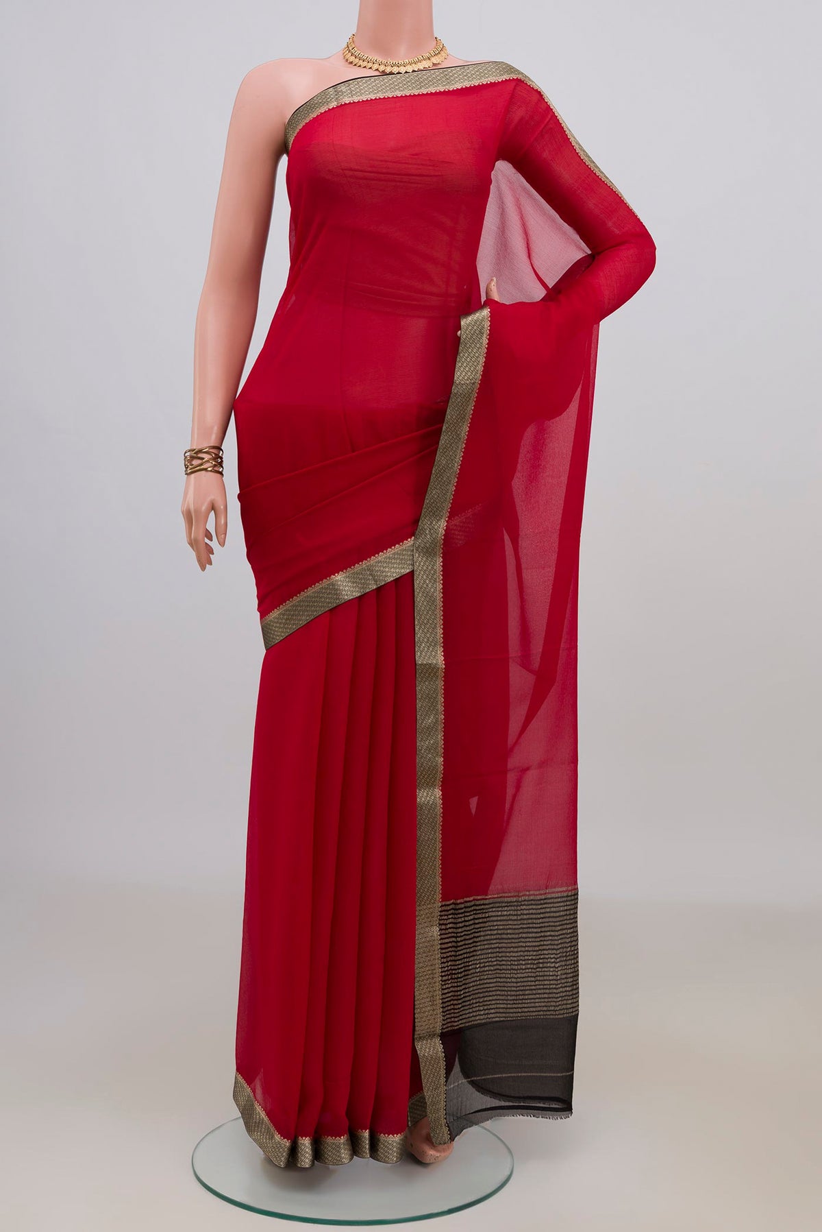 Red Mysore Chiffon Saree with Plain Body and Zari Border.  displayed on a mannequin