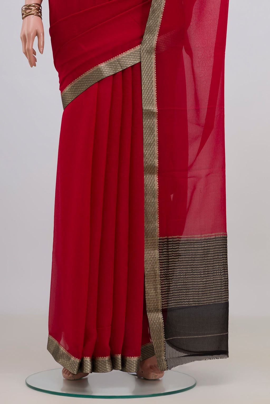 Pleats and pallu of Red Mysore Chiffon Saree with Plain Body and Zari Border. 