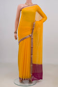Yellow Mysore Chiffon Saree with Plain Body and Zari Border.  displayed on a mannequin