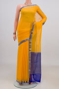 Yellow Mysore Chiffon Saree with Plain Body and Zari Border.  displayed on a mannequin