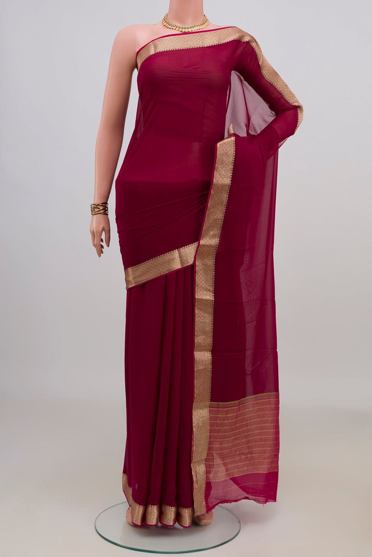 Magenta Mysore Chiffon Saree with Plain Body and Zari Border.  displayed on a mannequin