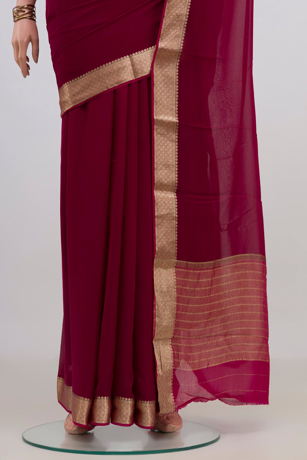Pleats and pallu of Magenta Mysore Chiffon Saree with Plain Body and Zari Border. 