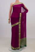 Magenta Mysore Chiffon Saree with Plain Body and Zari Border.  displayed on a mannequin
