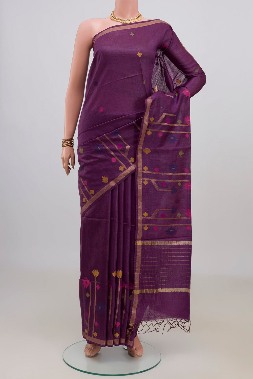Pure Silk Purple Tussar Saree with Thread Butta on the body and Thin Zari Line.  displayed on a mannequin