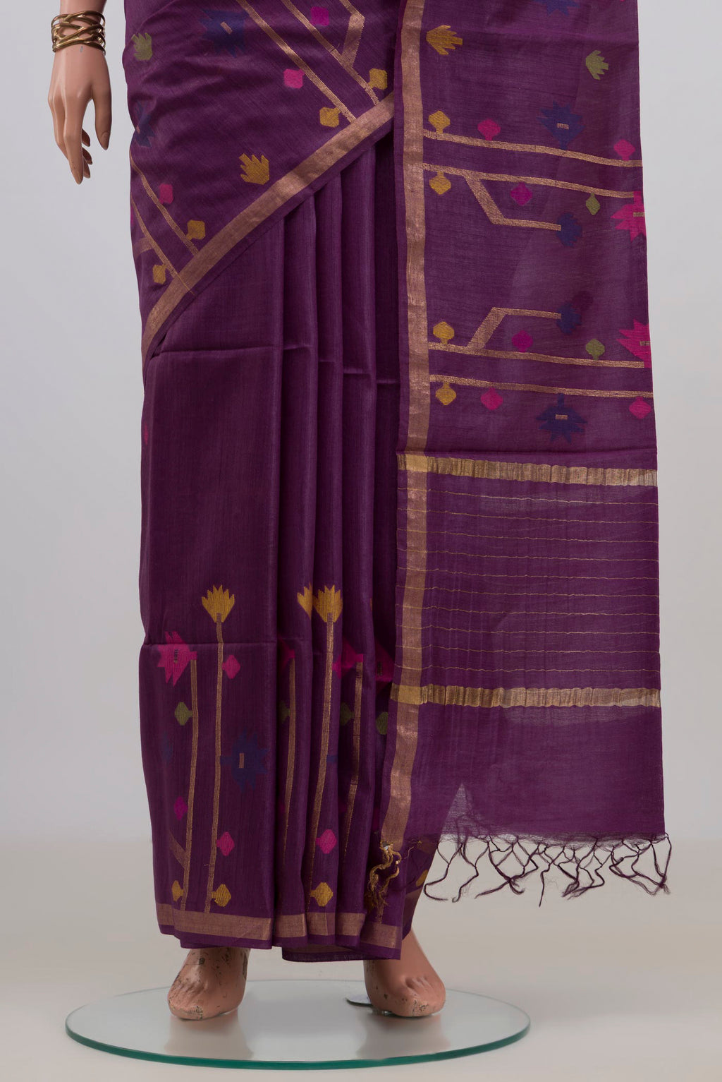 Pleats and pallu of Pure Silk Purple Tussar Saree with Thread Butta on the body and Thin Zari Line. 