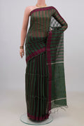 Pure Silk Green Tussar Saree with Thread Butta on the body and Thread Border.  displayed on a mannequin