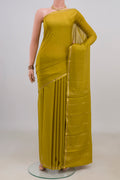 Mehandi Green Mysore Crepe Saree with Plain Body and Thin Zari Line.  displayed on a mannequin