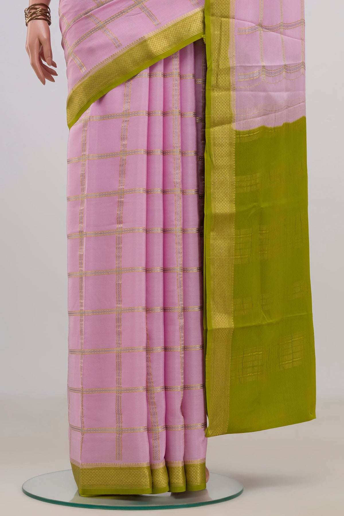 Pleats and pallu of Pink Crepe Saree with Checked design on the body and Zari Border. 