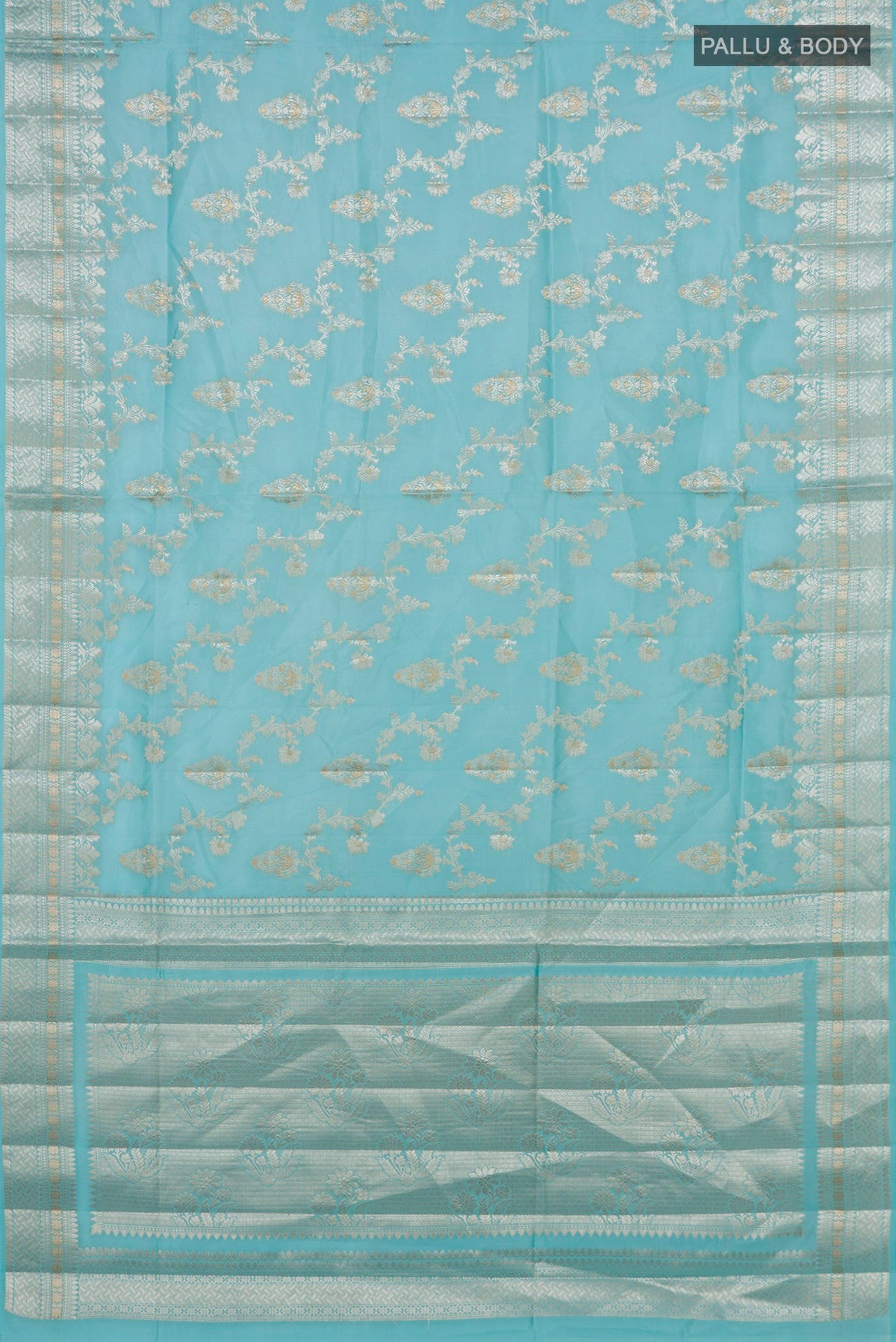 Flat view of Pure Silk Light Blue Banarasi Raw Saree with Zari And Thread Butta on the body and Fancy Border. 