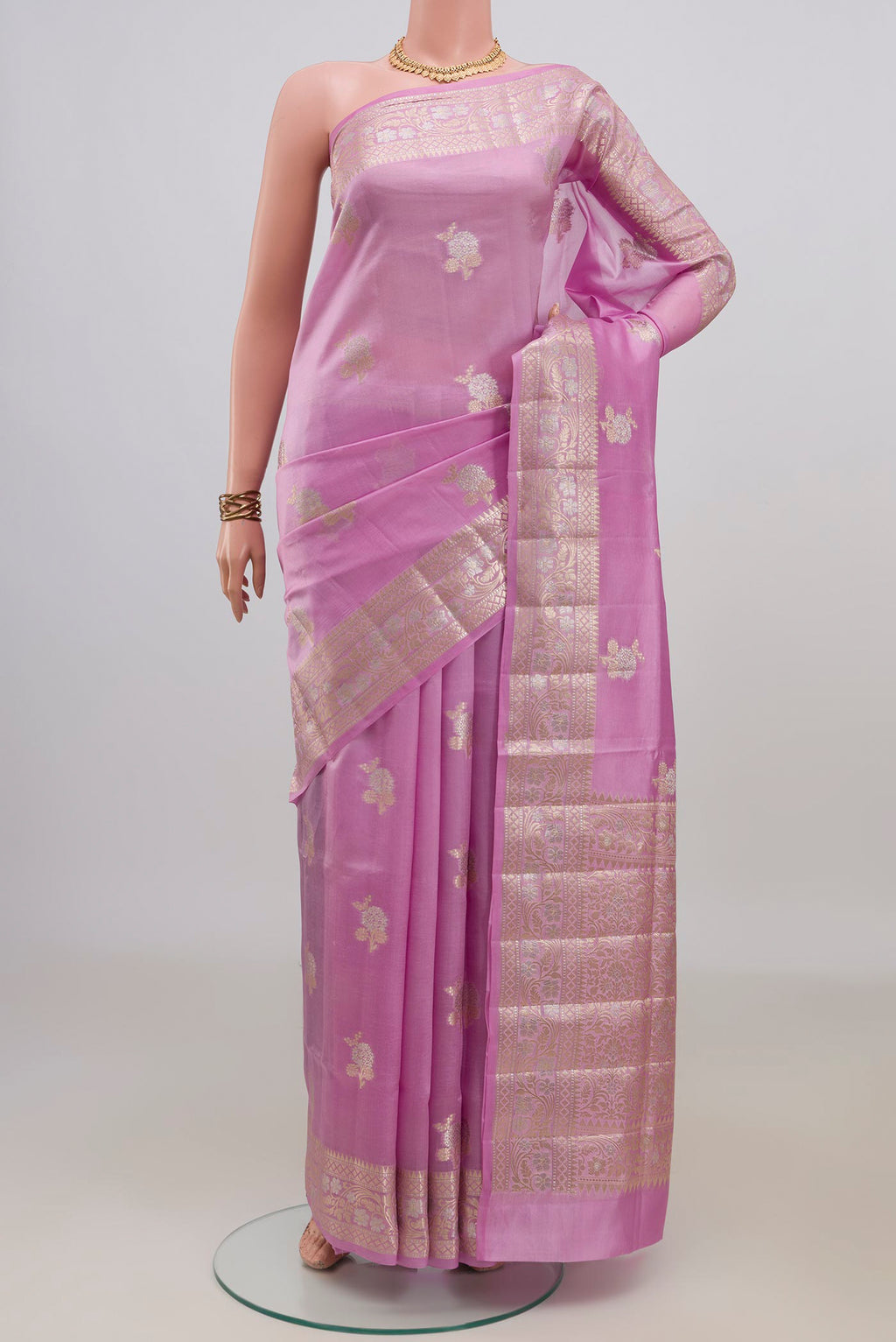 Pure Silk Pink Banarasi Raw Saree with Zari Butta on the body and Fancy Border.  displayed on a mannequin