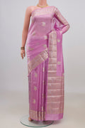 Pure Silk Pink Banarasi Raw Saree with Zari Butta on the body and Fancy Border.  displayed on a mannequin