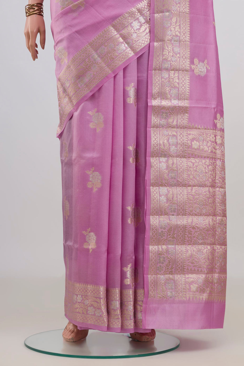 Pleats and pallu of Pure Silk Pink Banarasi Raw Saree with Zari Butta on the body and Fancy Border. 