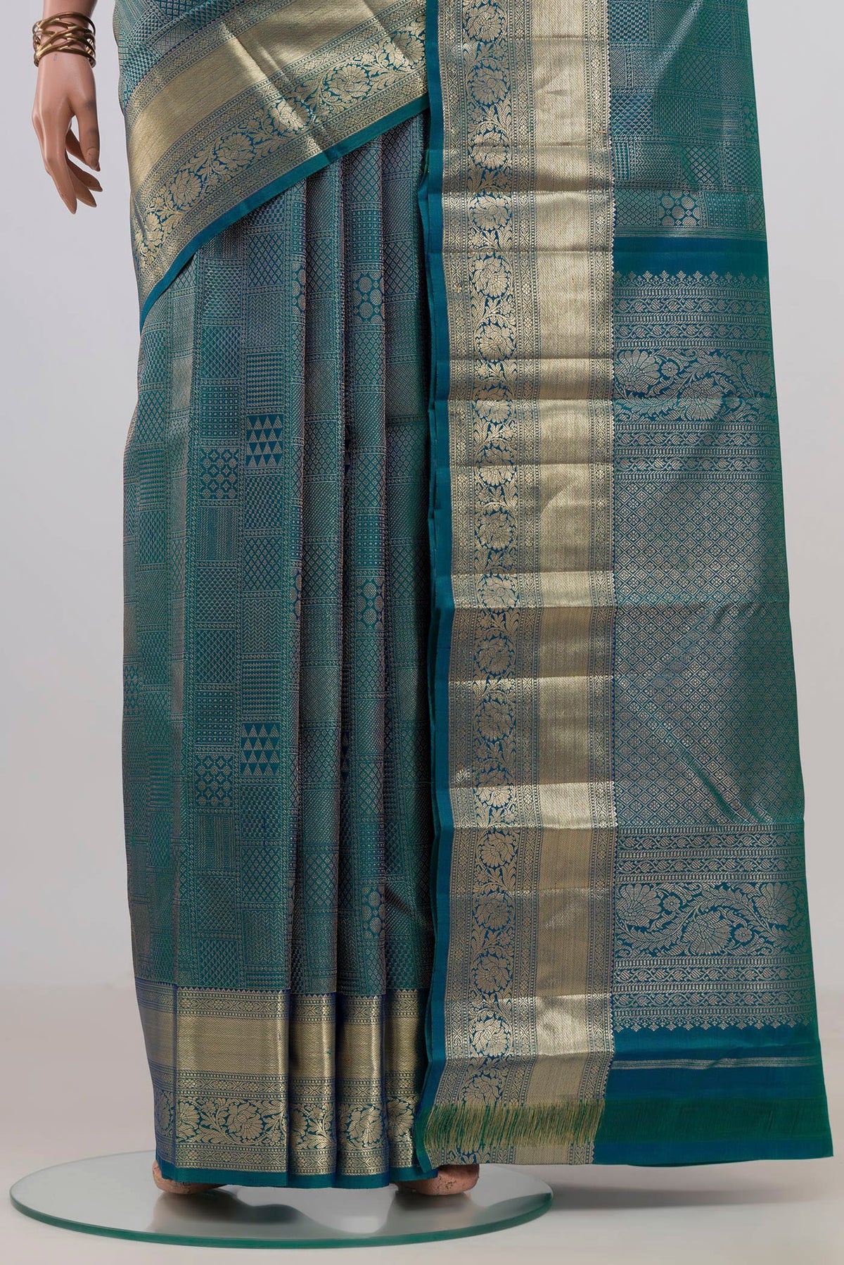 Pleats and pallu of Pure Silk Peacock Blue Kanjivaram Saree with Zari Brocade on the body and Zari Border. 