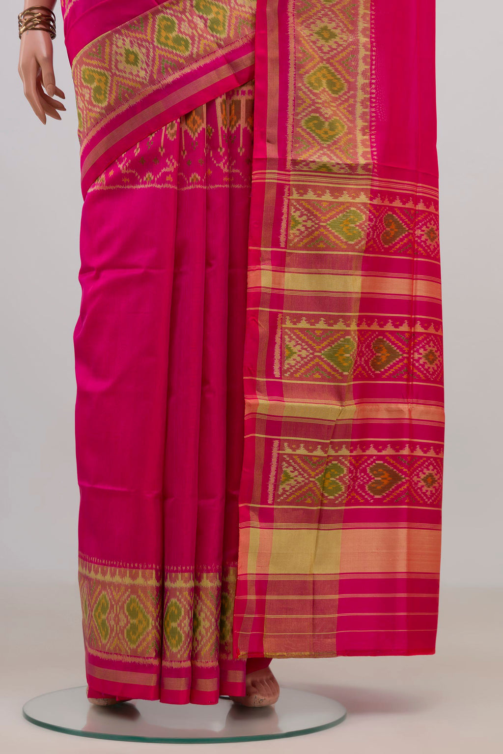 Pleats and pallu of Pure Silk Pink Rajkot Patola Saree with Pure Ikat on the body and Ikat Border. 