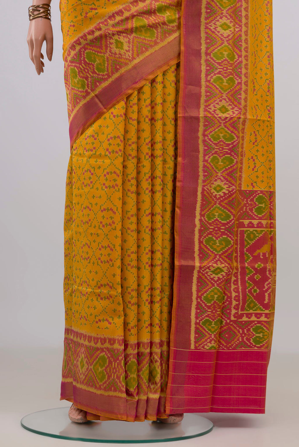 Pleats and pallu of Pure Silk Yellow Rajkot Patola Saree with Pure Ikat on the body and Ikat Border. 