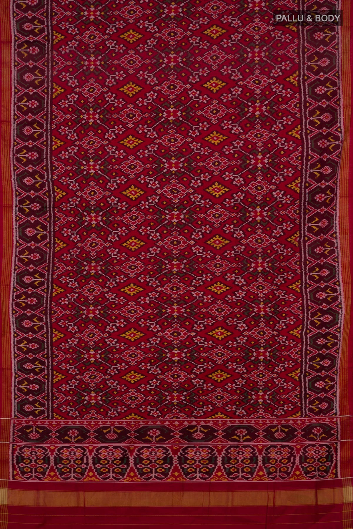 Flat view of Pure Silk Maroon Rajkot Patola Saree with Ikat design on the body and Ikat Border. 