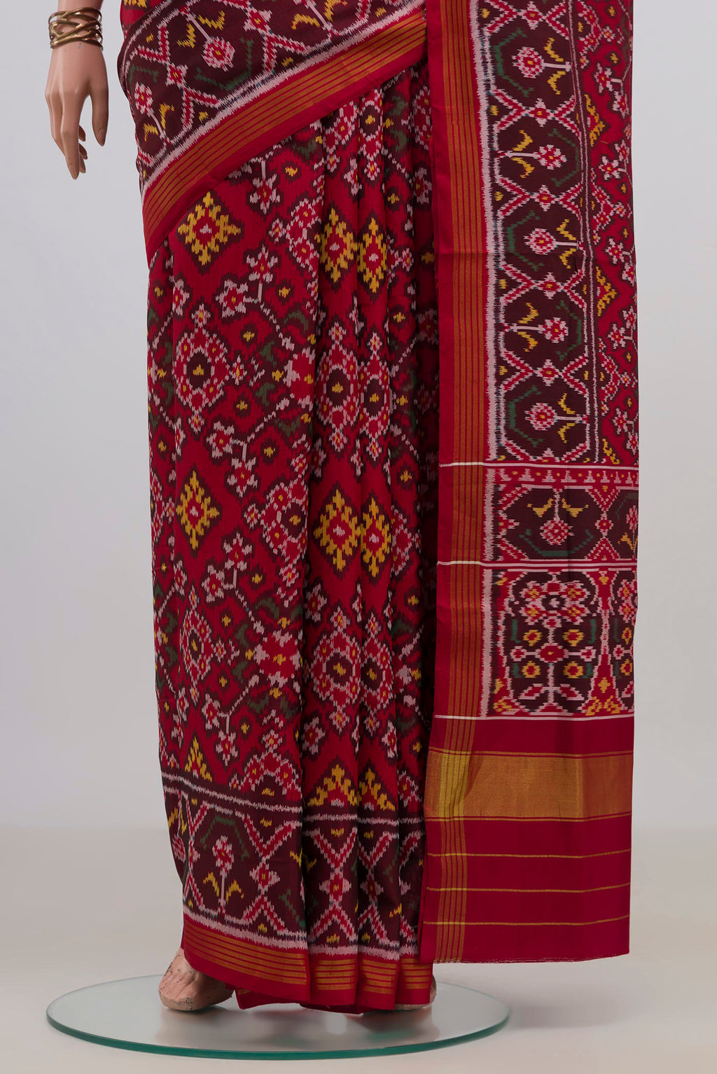 Pleats and pallu of Pure Silk Maroon Rajkot Patola Saree with Ikat design on the body and Ikat Border. 