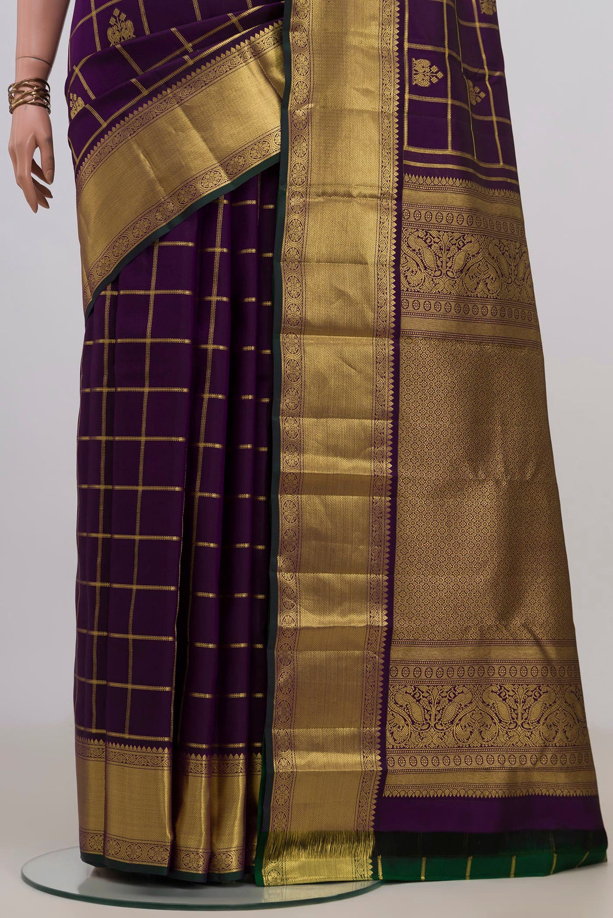 Pleats and pallu of Pure Silk Purple Kanchipuram Saree with Checked design on the body and Zari Border. 