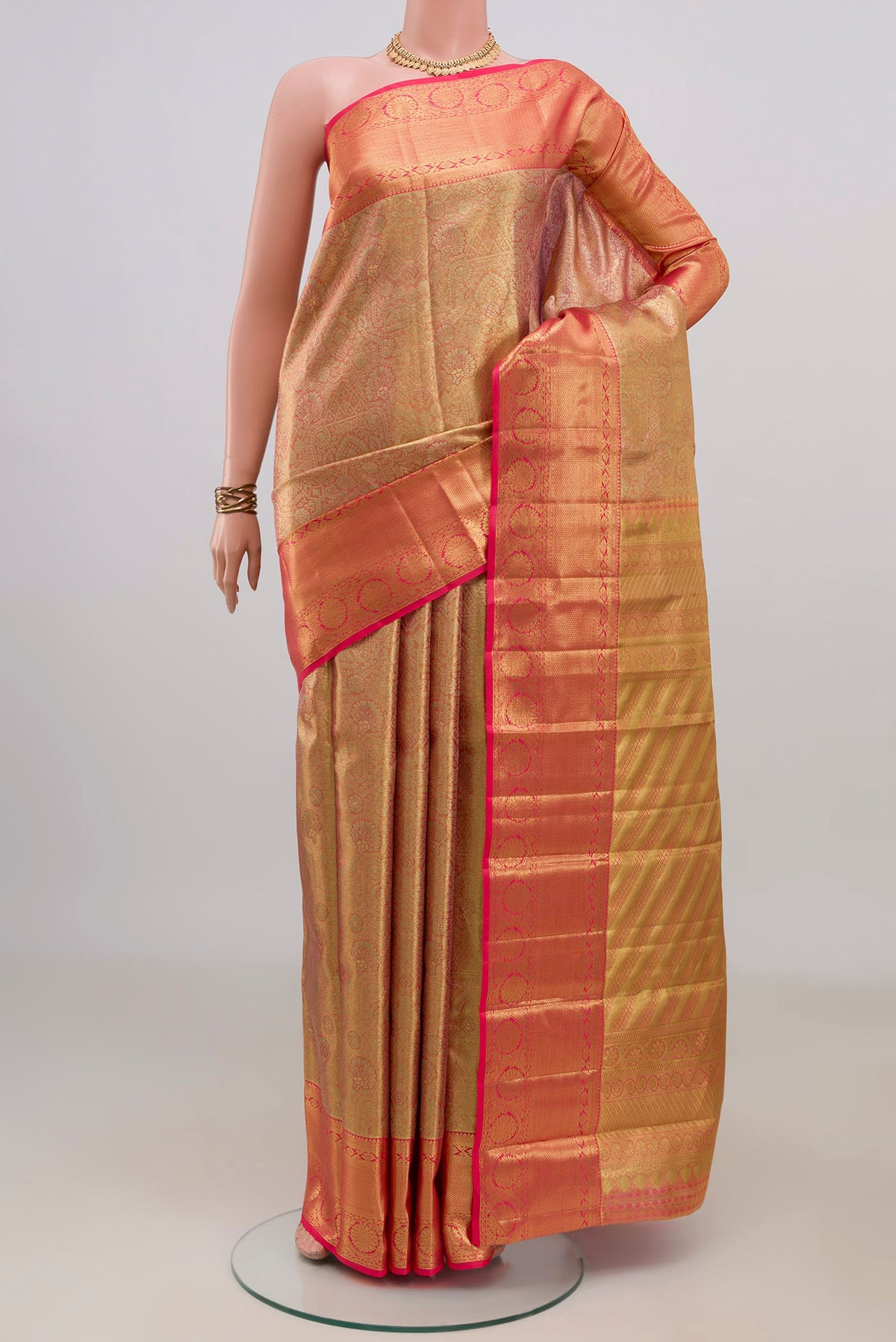 Golden Dual Tone Kanchipuram Saree with Zari Brocade on the body and Zari Border.  displayed on a mannequin