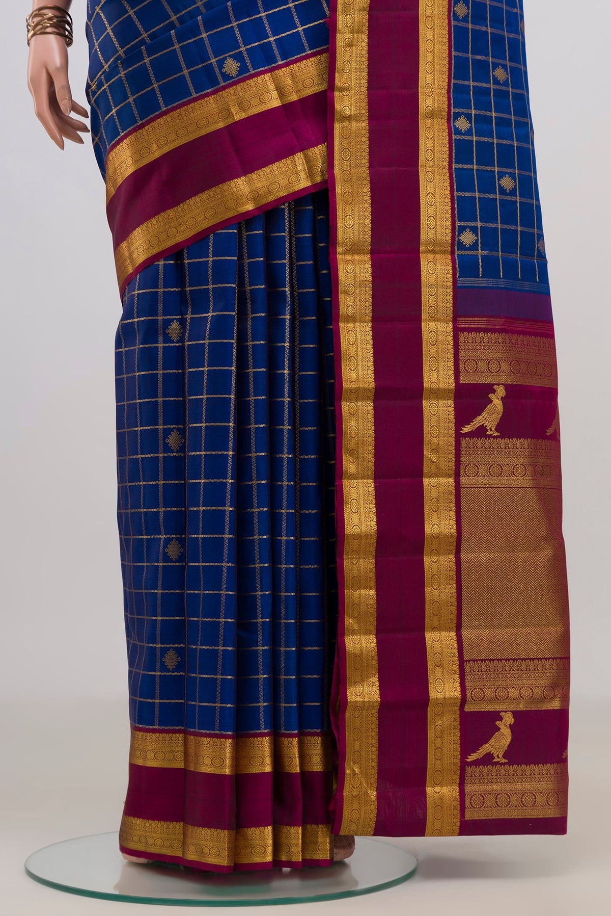 Pleats and pallu of Pure Silk Blue Kanjivaram Saree with Checked design on the body and Zari Border. 
