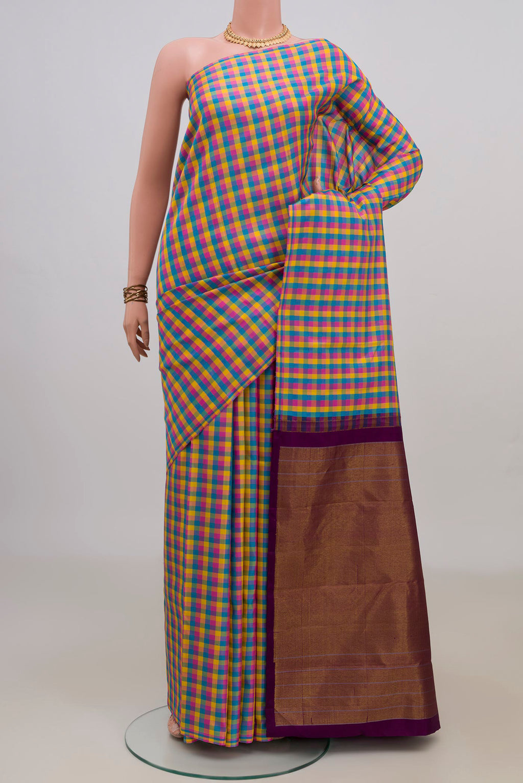 Pure Silk Multi Color Kanchipuram Saree with Checked design on the body and Without Border.  displayed on a mannequin