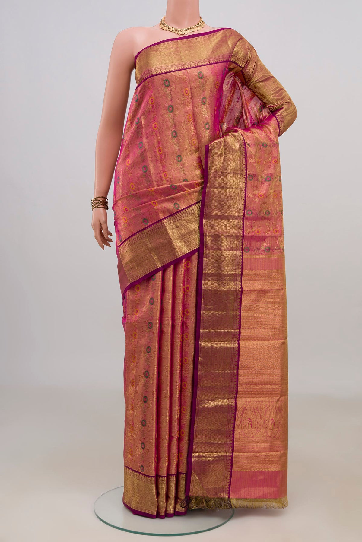 Pink Dual Tone Kanchipuram Tissue Saree with Zari Brocade on the body and Zari Border.  displayed on a mannequin