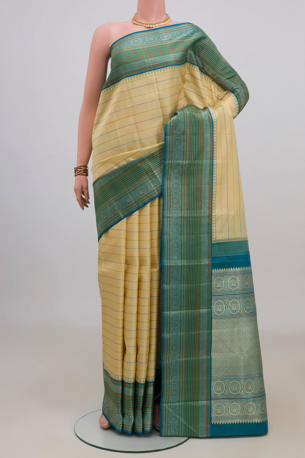 Pure Silk Sandal Kanjivaram Saree with Veldhari on the body and Thread Border.  displayed on a mannequin