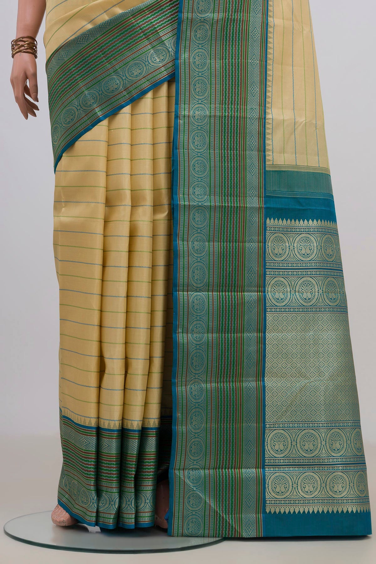 Pleats and pallu of Pure Silk Sandal Kanjivaram Saree with Veldhari on the body and Thread Border. 