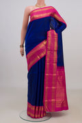 Pure Silk Blue Kanjivaram Saree with Plain Body and Zari Border.  displayed on a mannequin