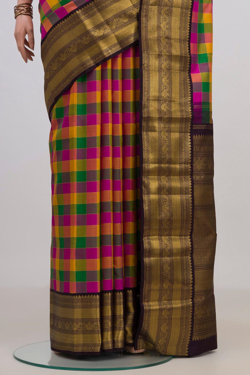 Pleats and pallu of Pure Silk Multi Color Kanchipuram Saree with Checked design on the body and Zari Border. 