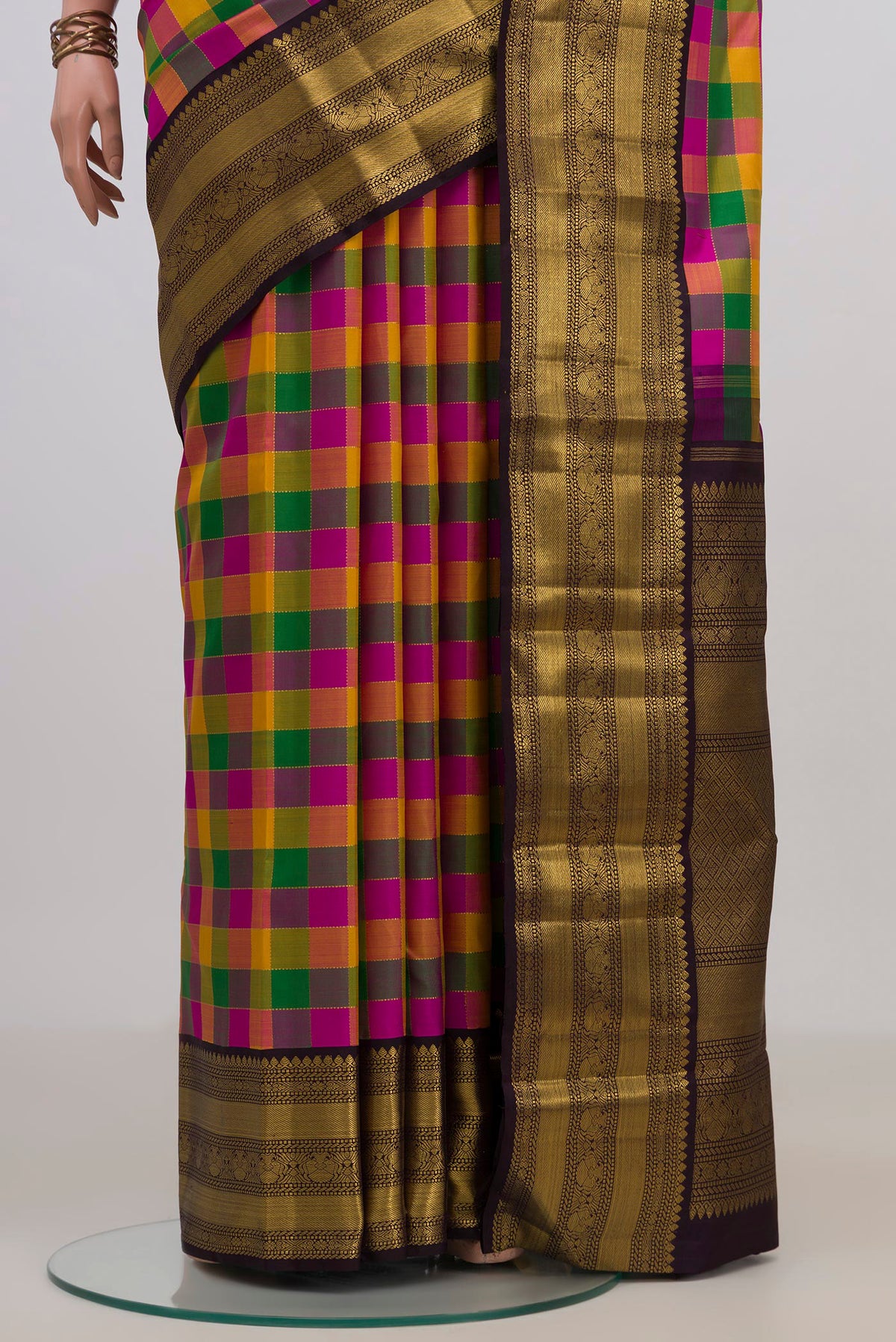 Pleats and pallu of Pure Silk Multi Color Kanchipuram Saree with Checked design on the body and Zari Border. 