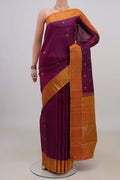 Pure Silk Pure Zari Purple Kanchipuram Saree with Zari Butta on the body and Thin Zari Line.  displayed on a mannequin
