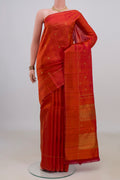 Pure Silk Pure Zari Rust Kanjivaram Saree with Zari Butta on the body and Thin Zari Line.  displayed on a mannequin