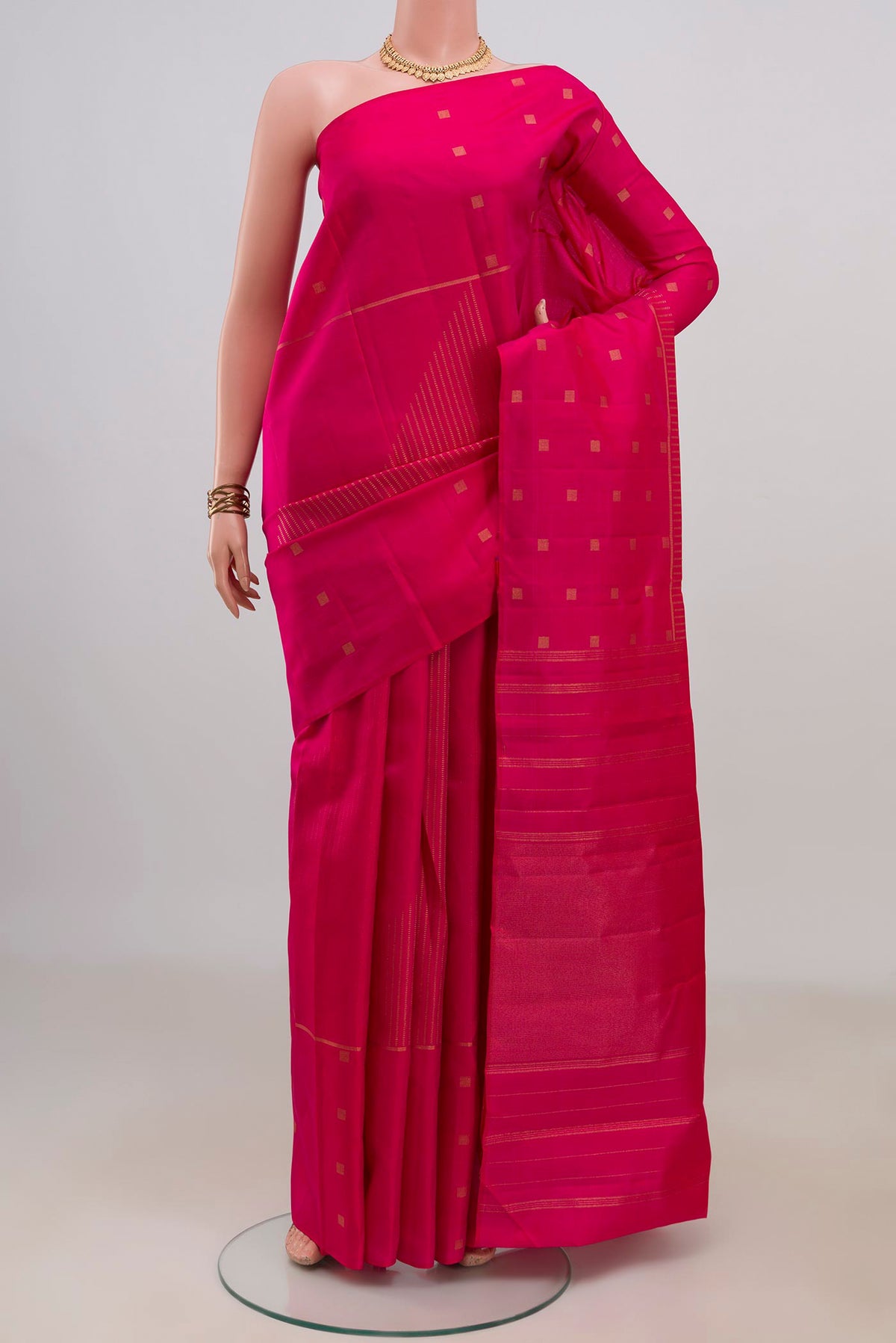 Pure Silk Pure Zari Pink Kanchipuram Saree with Stripes on the body and Fancy Border.  displayed on a mannequin