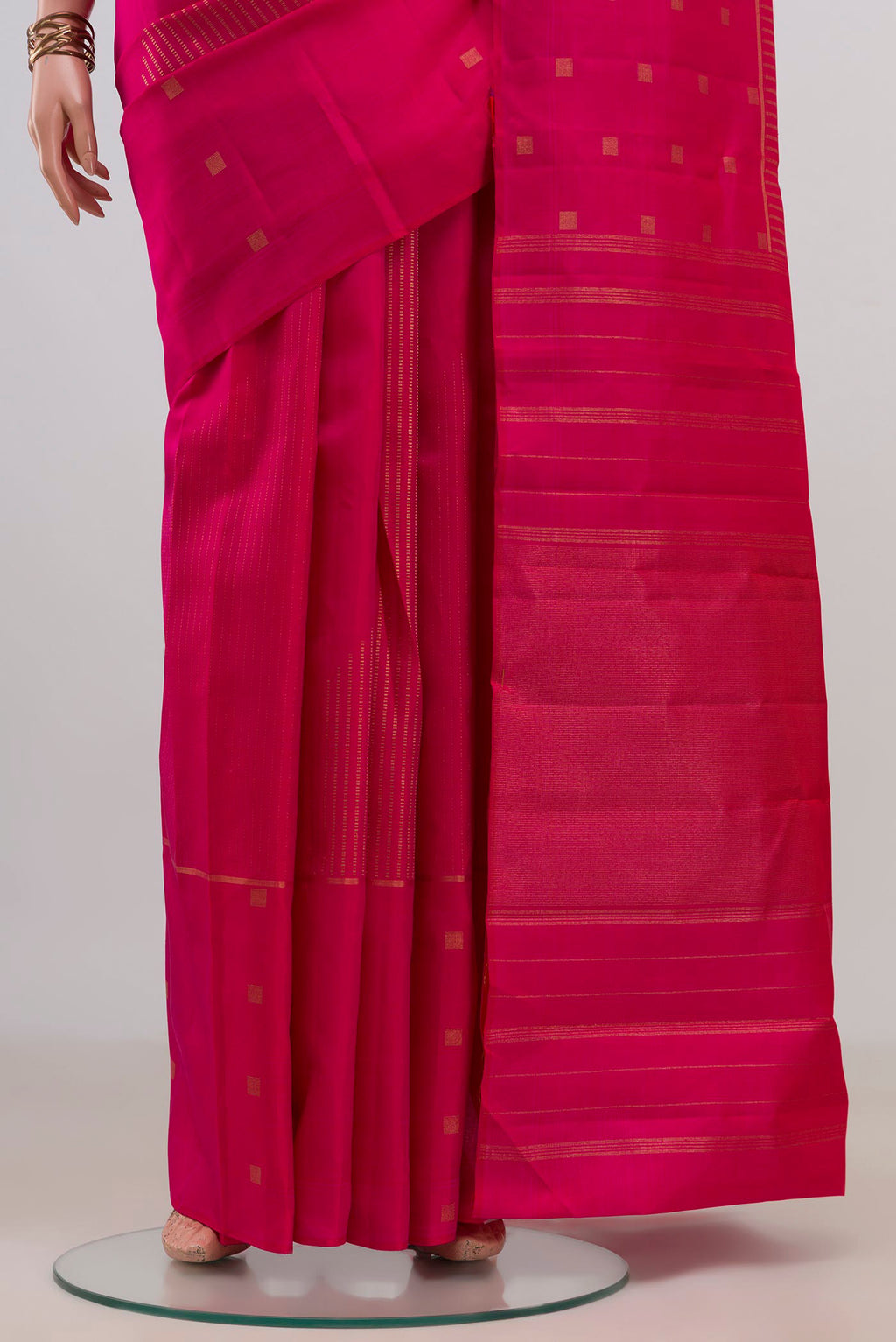 Pleats and pallu of Pure Silk Pure Zari Pink Kanchipuram Saree with Stripes on the body and Fancy Border. 