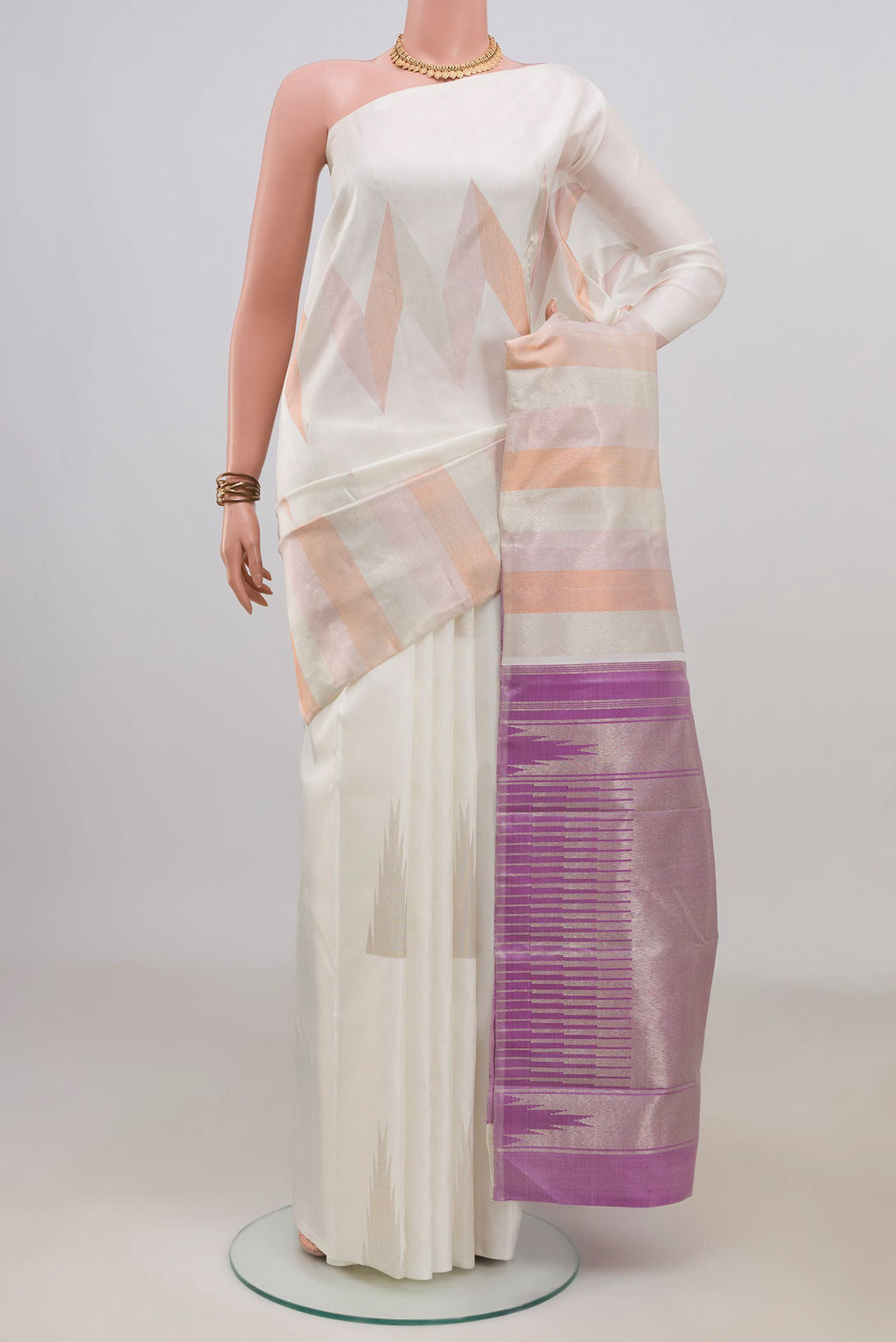 Pure Silk White Kanchipuram Saree with Fancy on the body and Rising Temple Border.  displayed on a mannequin