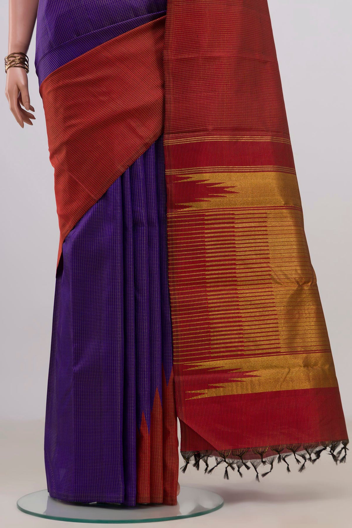 Pleats and pallu of Pure Silk Violet Kanjivaram Saree with Checked design on the body and Rising Temple Border. 