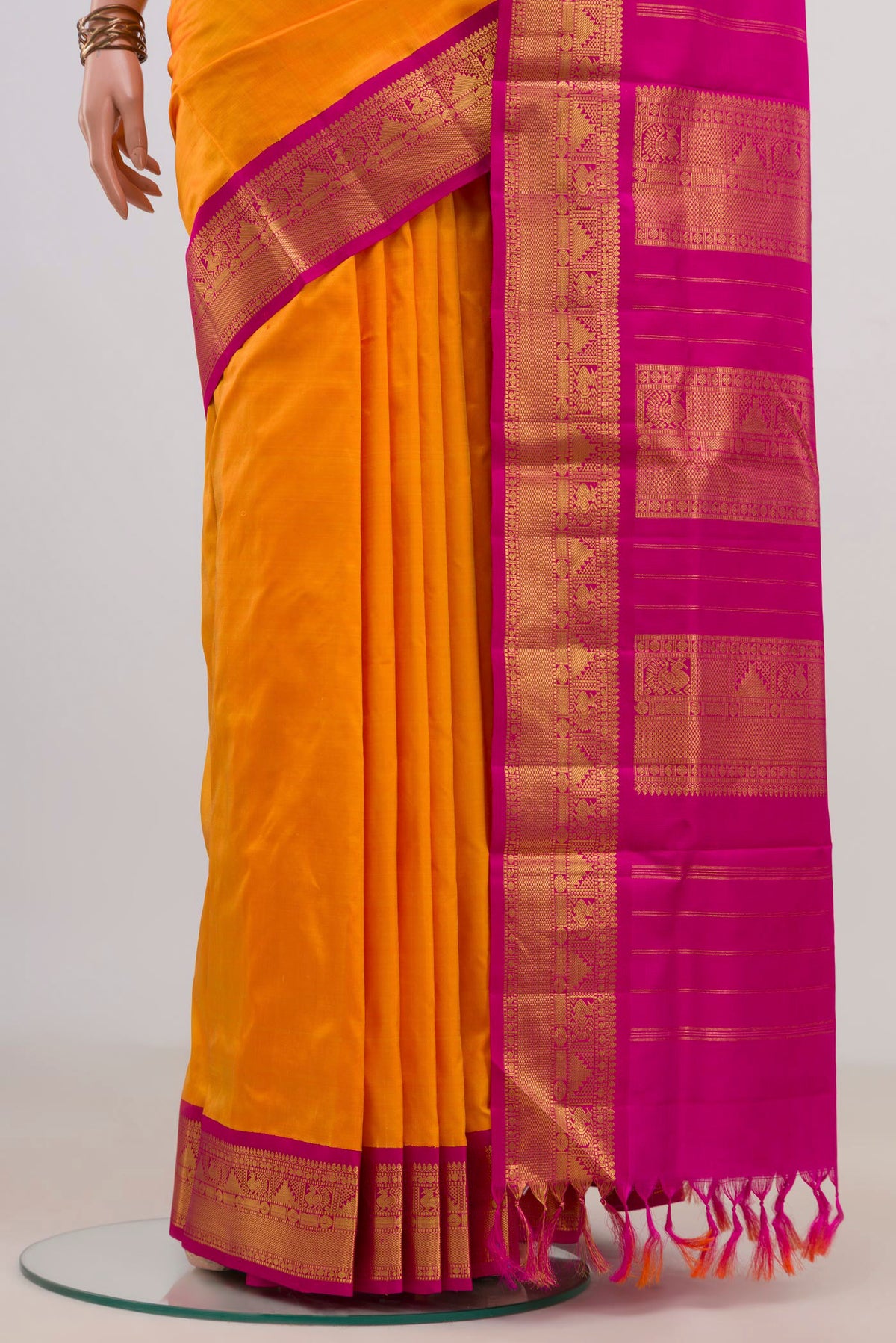 Pleats and pallu of Pure Silk Yellow Kanchipuram Nine Yards Saree with Plain Body and Zari Border. 